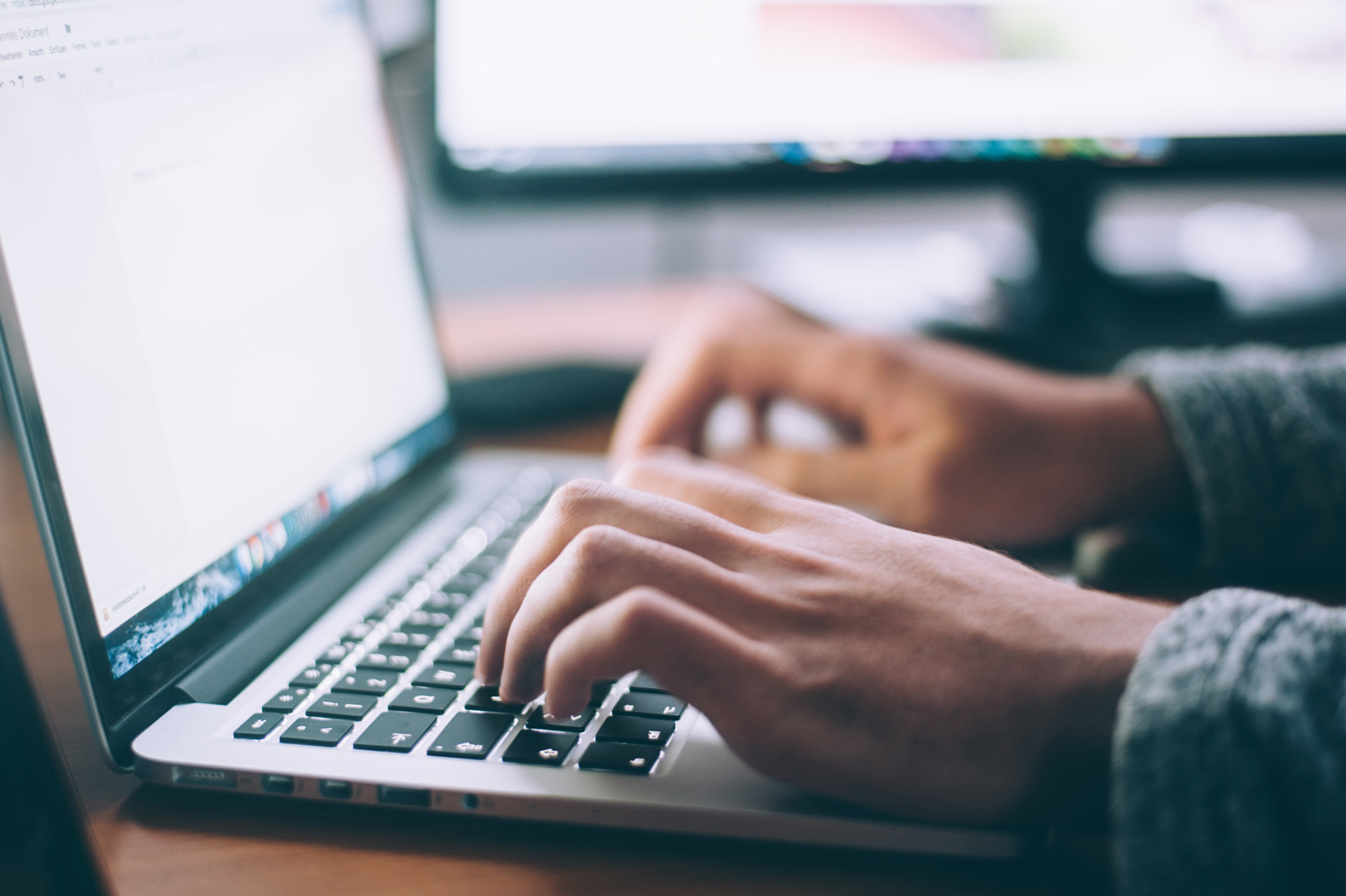 hands at the keyboard of a laptop
